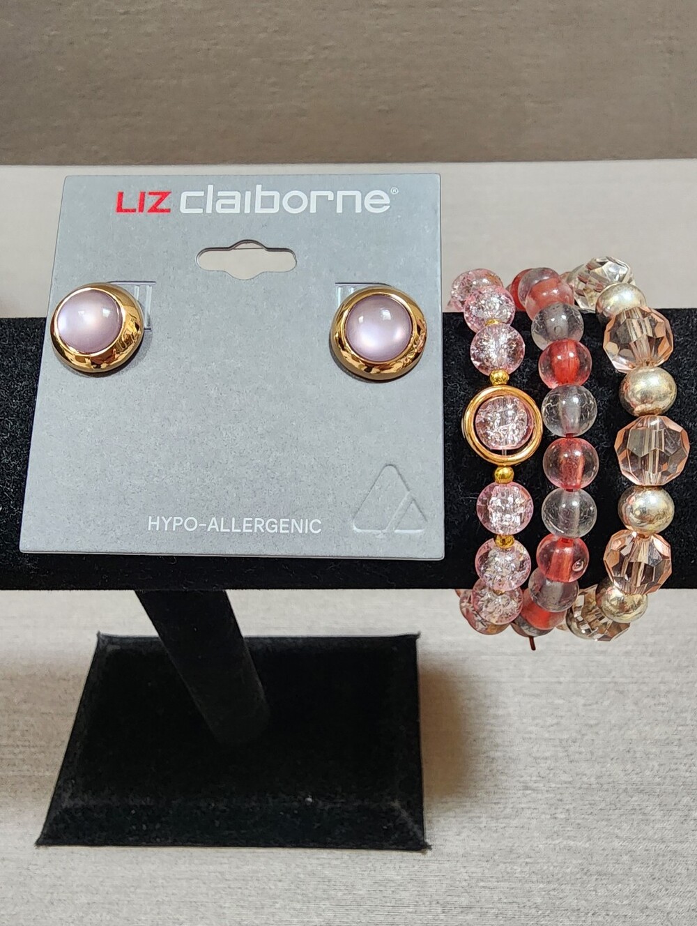 GROUP OF PINK TONE EARRINGS AND 3 STRETCH BRACELETS. NWOT